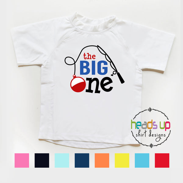 birthday rashguard the big one birthday theme one year old 1 1st first birthday bday party apparel custom fishing bobber swim pool beach ocean vacation cruise. SPF sun protection soft comfortable 2 3 4 5 white red blue cute popular design best seller fast shipping. Heads up Shirts quality custom kids clothing. 